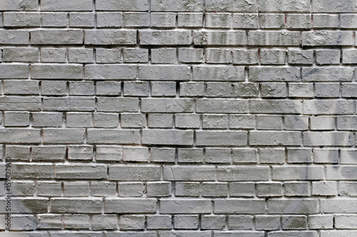 Grey painted brick wall as background, texture
