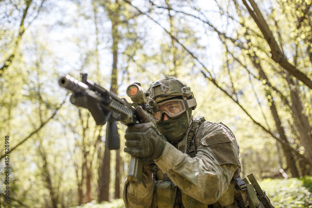 Soldier on assignment in woods