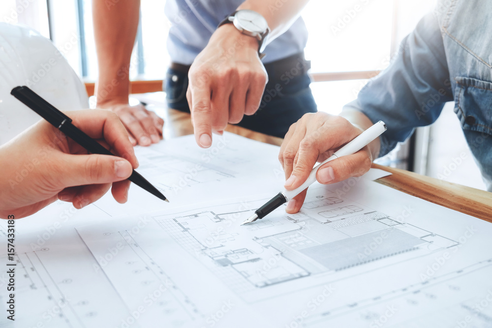 © ijeab - Engineer meeting for architectural project. working with partner