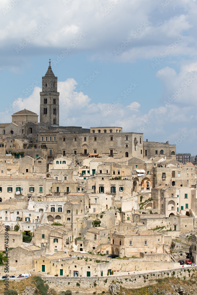 Matera, Italy - May 20 2017: Panoramic view of the city from the belvedere square with background the clouds in the sky