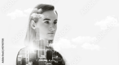 Portrait of attractive business woman, Double exposure concept with business woman and panoramic view contemporary megalopolis background