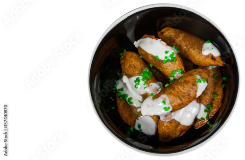 Fried Ravioli with Sauce. top view. isolated on white