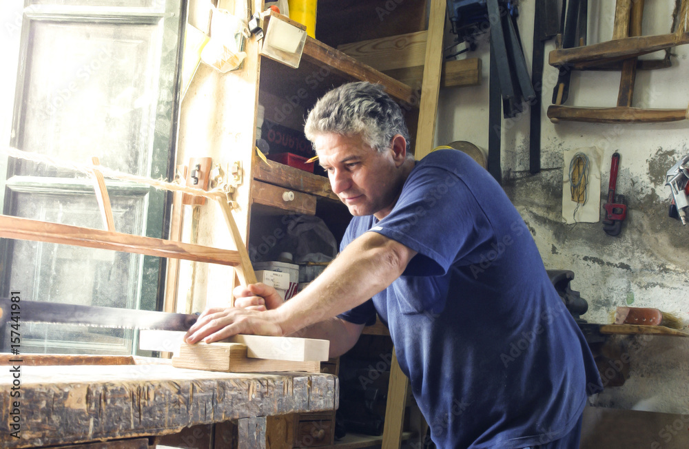 Carpenter working in a traditional way Carpenter working in a traditional way
