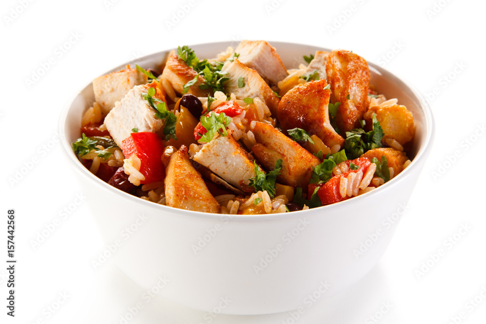 Roast chicken filet with rice and vegetables on white background Roast chicken filet with rice and vegetables on white background