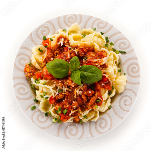 Pasta with meat and tomato sauce on white background