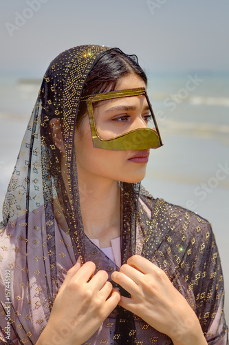 Persian girl in traditional islamic mask of southern Iran, portrait. photo