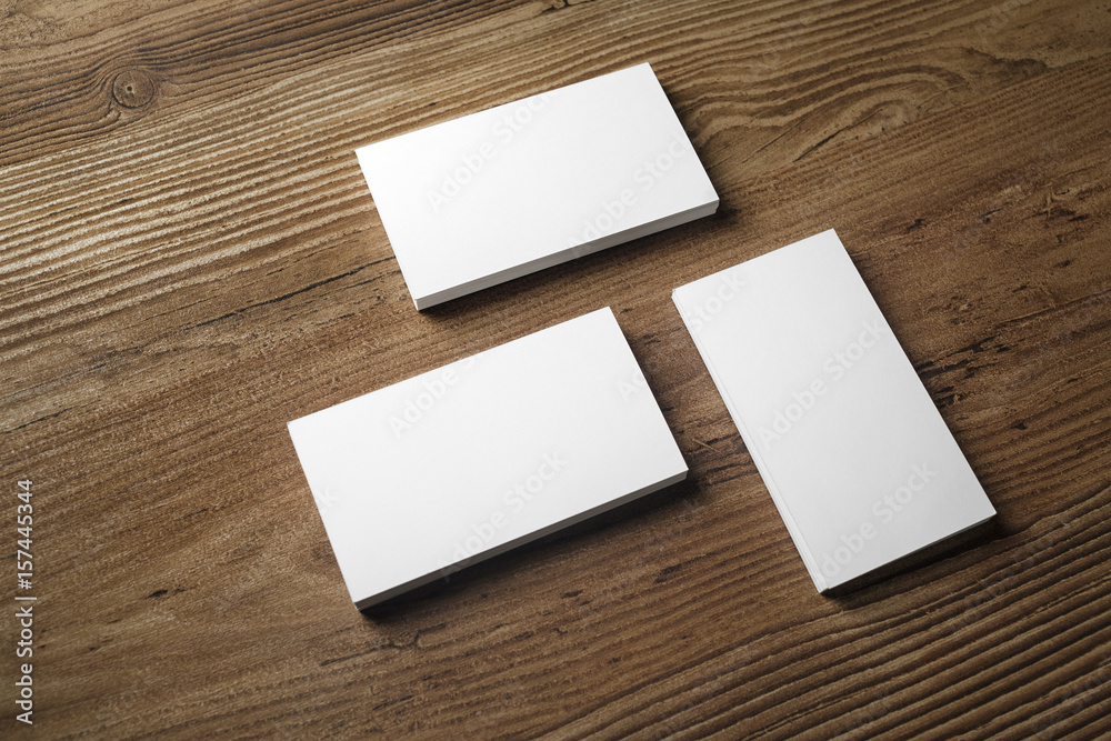Photo of blank business cards on wooden background. Template for ID. Responsive design mockup. Photo of blank business cards on wooden background. Template for ID. Responsive design mockup.