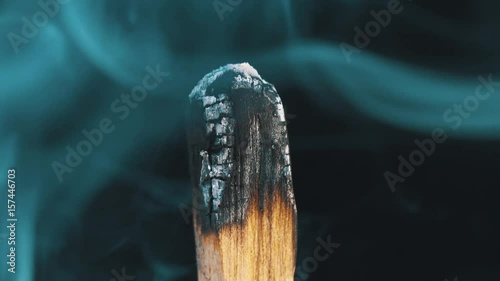 Palo Santo Wood Incense smoke on black background in slow motion