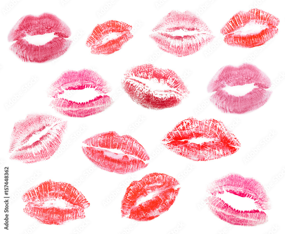 Different lipstick prints of women lips on white background - obrazy, fototapety, plakaty 