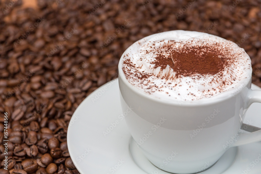 cup of cappuccino with coffee beans cup of cappuccino with coffee beans