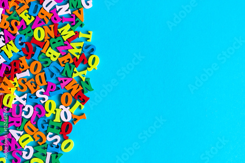 English letters on blue background composed from colorful abc alphabet leter. Back to school concept or Learning english or other language courses. Empty space, Copy space