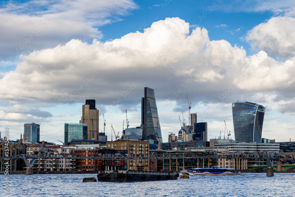 Naklejka premium Business district with famous skyscrapers and landmarks at golden hour, London, UK