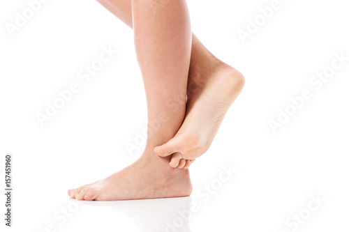 Women's feet on white background. © agnieszka_marcinska
