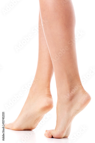 Women's feet on white background.