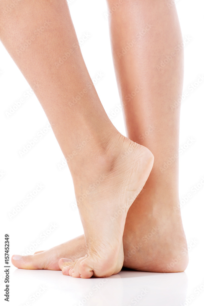 Women's feet on white background. Women's feet on white background.