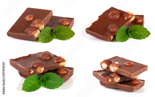 Chocolate with hazelnut and mint leaf isolated on white background. Set or collection