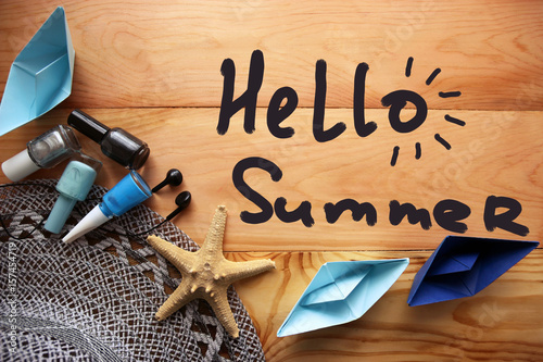 Phrase Hello Summer.Summer vacation concept on a wooden background