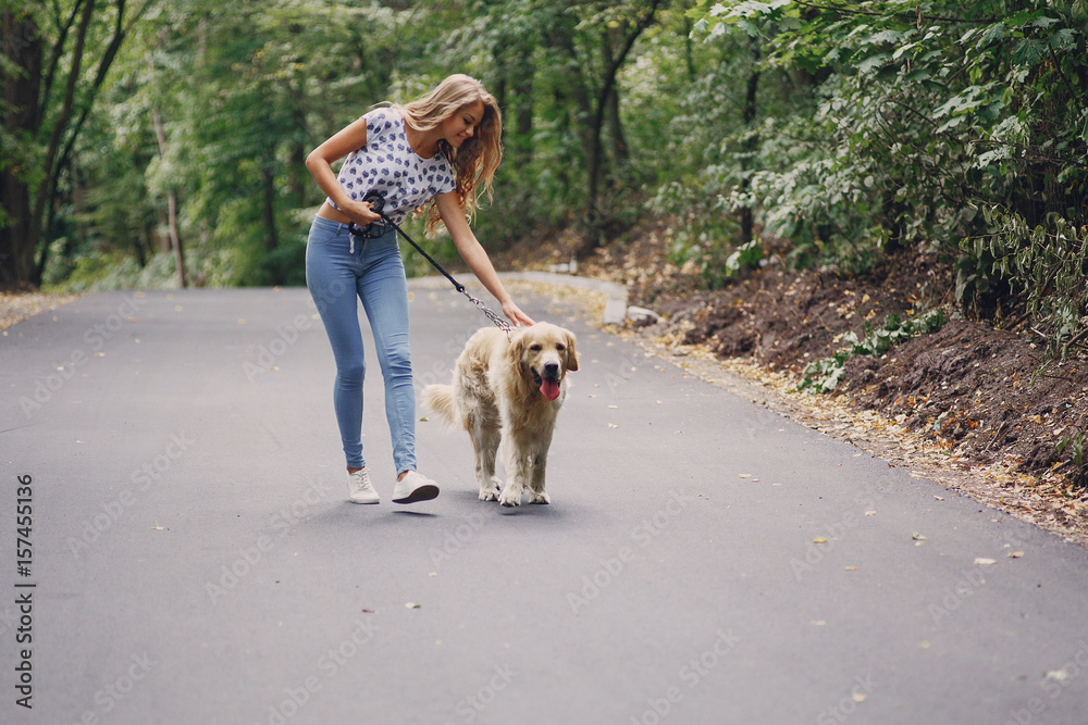 couple walking outdoors with her dog couple walking outdoors with her dog