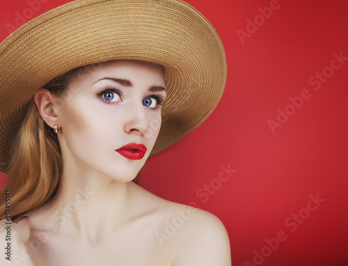 Young woman on a red background