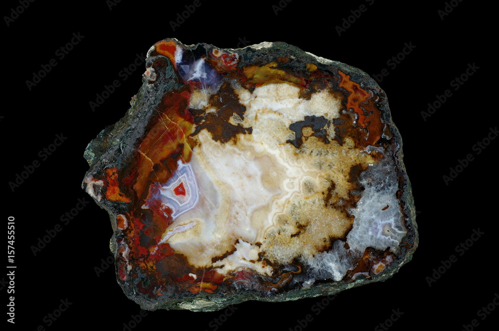 A cross section of the agate stone. Colorful chalcedony with agate, hematite and calcite. Origin: Asni, Atlas Mountains, Morocco. A cross section of the agate stone. Colorful chalcedony with agate, hematite and calcite. Origin: Asni, Atlas Mountains, Morocco.