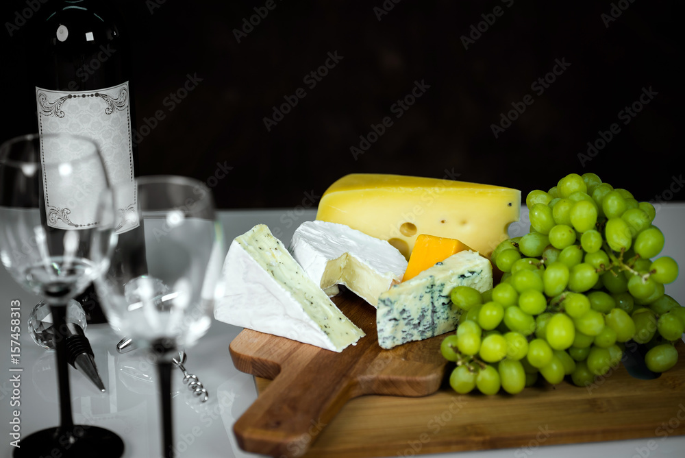 White Wine And Assorted Cheese Plate with fruit