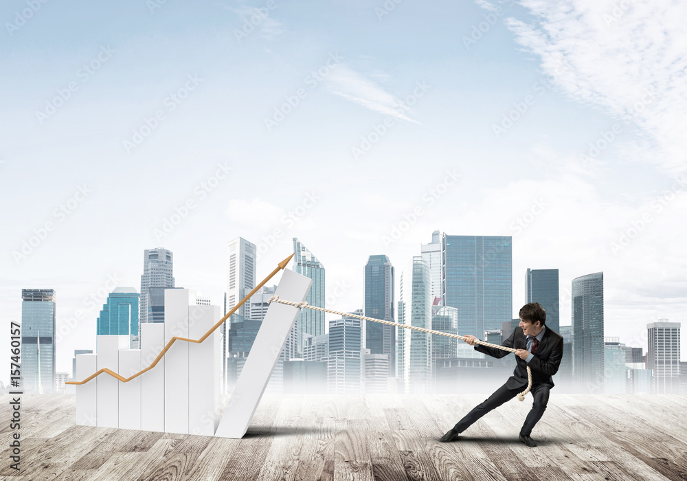 Man pulling with effort big pulling rope graph, as a symbol of financial growth