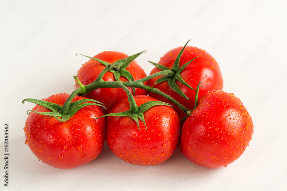 Red fresh tomatoes isolated on white background Red fresh tomatoes isolated on white background