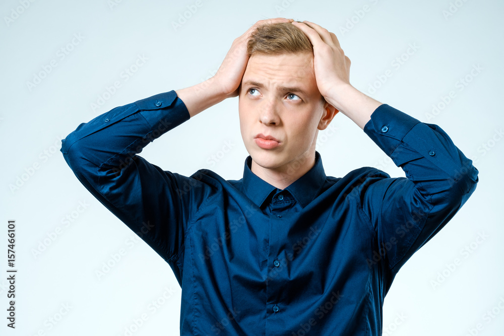 Portrait of stressed young man isolated