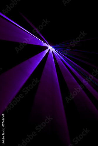 Laser beam purple on a black background