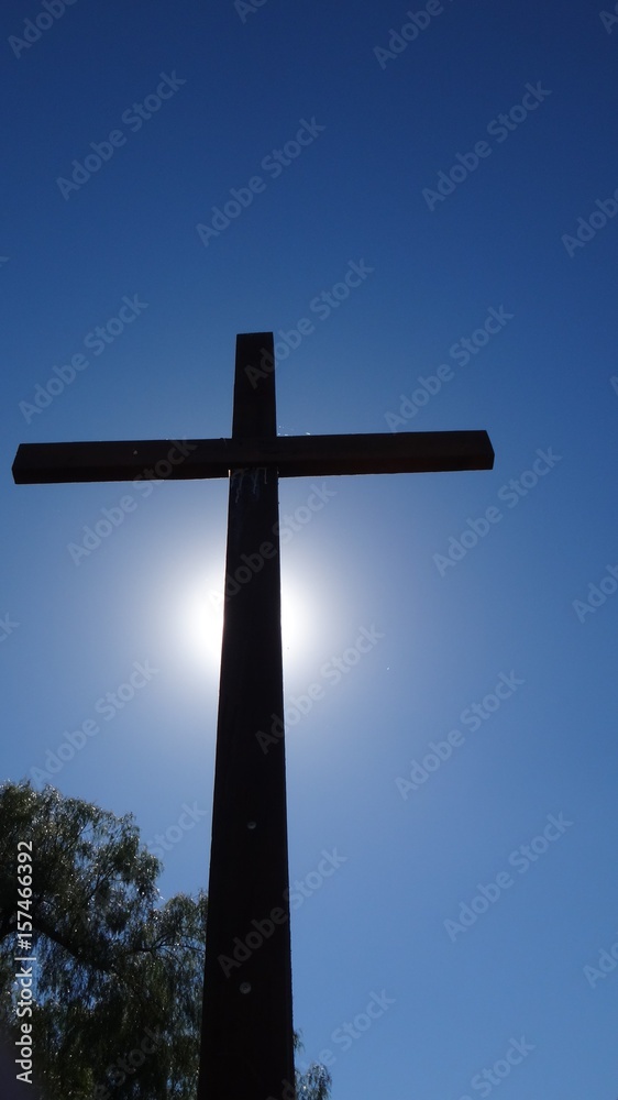 Silhouette of Cross against Blue Sky