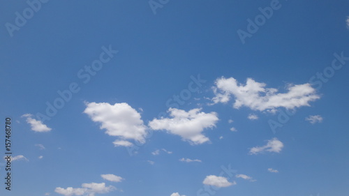 Puffy Clouds in Bright Blue Sky
