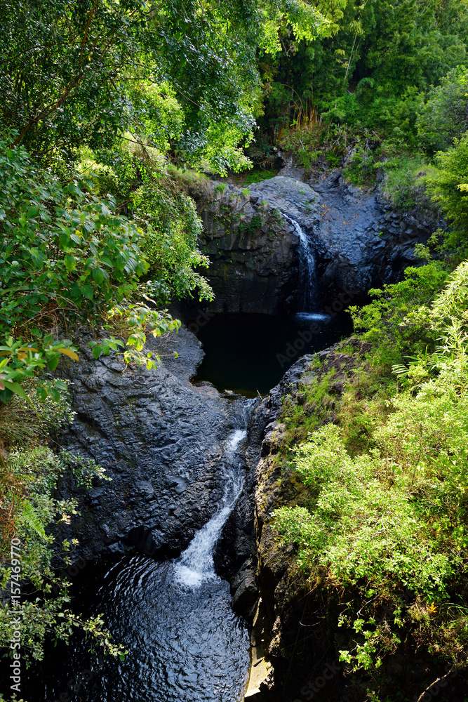 Two waterfalls and water puddle along the Pipiwai Trail in the Haleakala National Park, Maui, Hawaii Two waterfalls and water puddle along the Pipiwai Trail in the Haleakala National Park, Maui, Hawaii