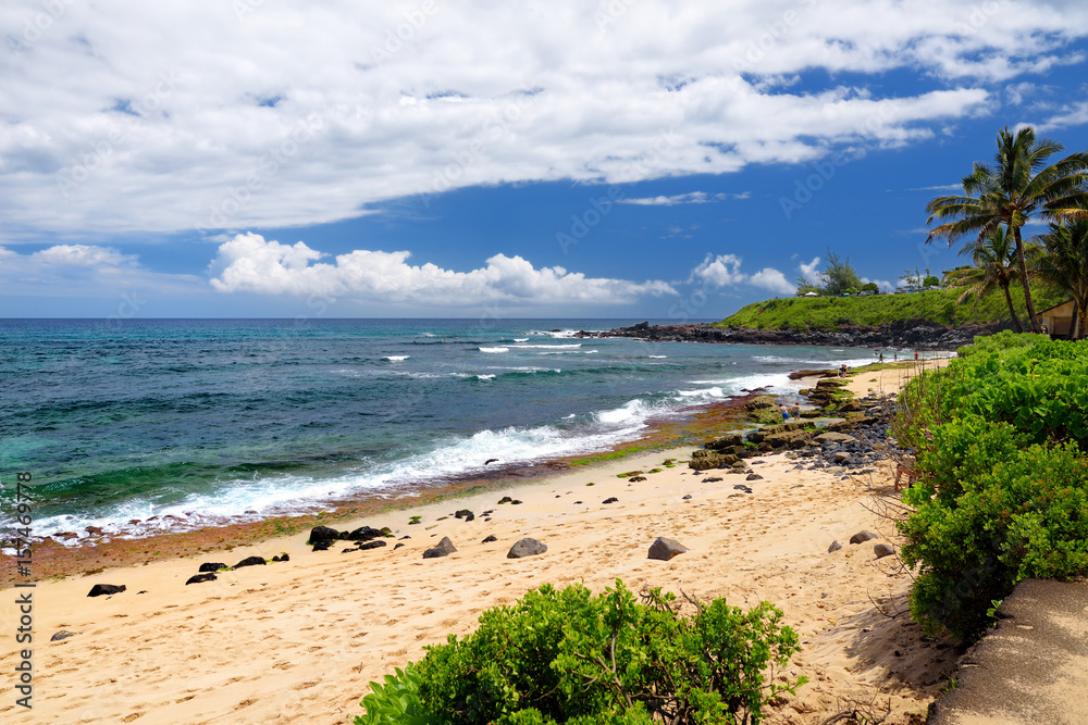 Famous Hookipa beach, popular surfing spot filled with a white sand beach, picnic areas and pavilions. Maui, Hawaii.