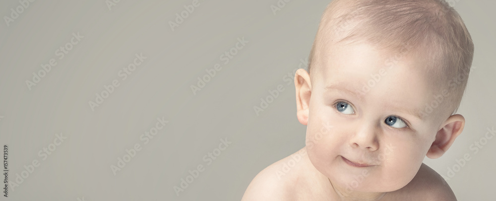 Adorable little baby boy posing. - obrazy, fototapety, plakaty 