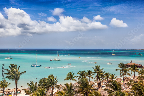 Sail and motor boats criss cross the bay at Palm Beach, Aruba