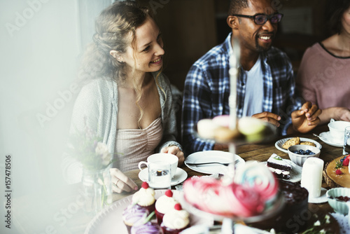 Murais de parede Friends Gathering Together on Tea Party Eating Cakes Enjoyment happiness