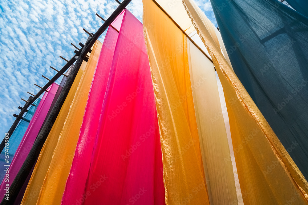 colorful fabric hanging to dry after traditional dye process,shot in Heng  Dian Town,Zhejiang province of China. Stock-Foto | Adobe Stock