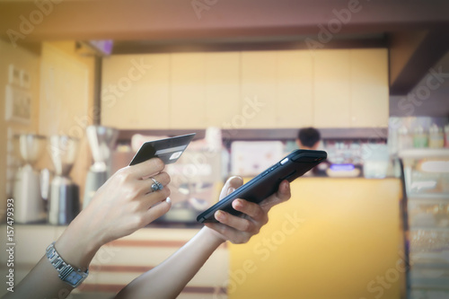 woman asian using smart phone and credit card shopping online , selective focus on hand