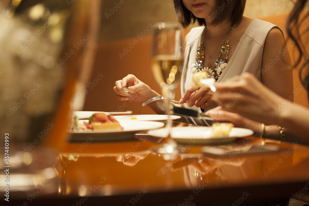 Women are having fun and eating at a restaurant