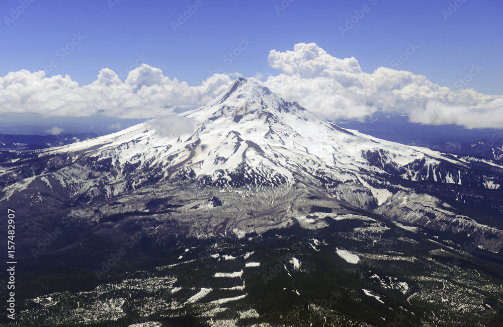 Snow covered Mount Hood, a volcano in the Cascade Mountains in Oregon popular for hiking, climbing, snowboarding and skiing, despite the risks of avalanche, crevasses and volatile weather on the peak.