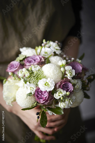 Fototapeta Naklejka Na Ścianę i Meble -  wedding bouquet in hands of bride