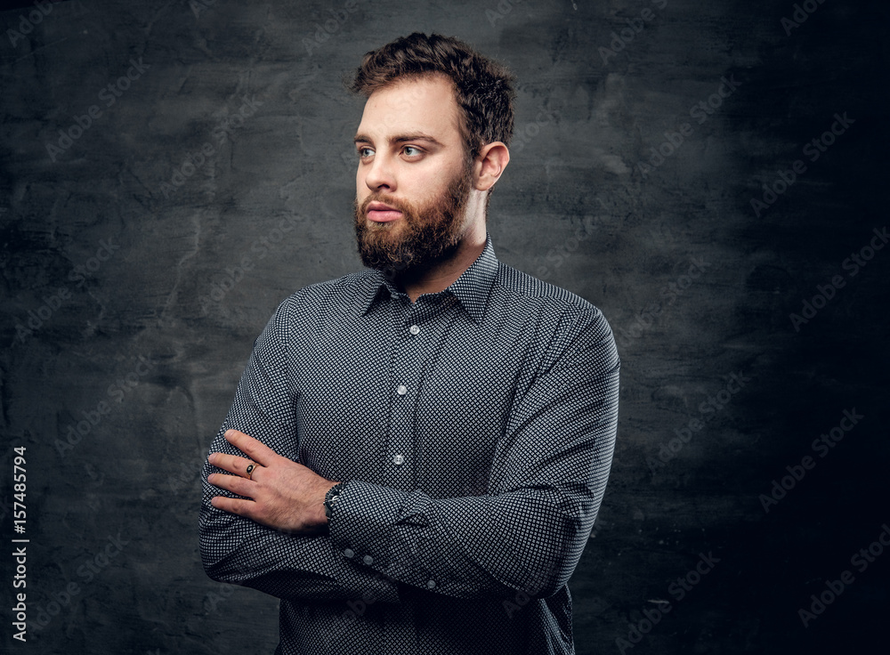 Bearded male with crossed arms over grey background. Bearded male with crossed arms over grey background.