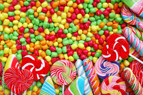 sweets and sugar candies colorful, handmade swirl lollipop for background