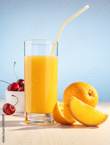 Orange juice, cherry berries and orange.