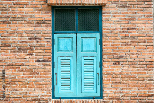 old wood window on brick wall