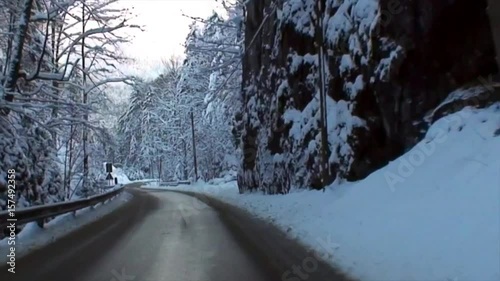 Snowy Drive on a Winding Alpine Road in High Speed Video III