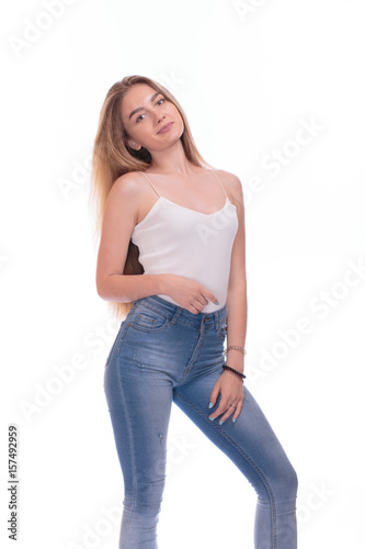 Beautiful blonde young woman standing. Isolated on a white background