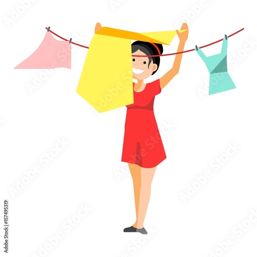 Cheerful woman drying clothes