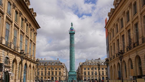 Photo of place Vendome obelisk on a spring cloudy morning, Paris, France photo
