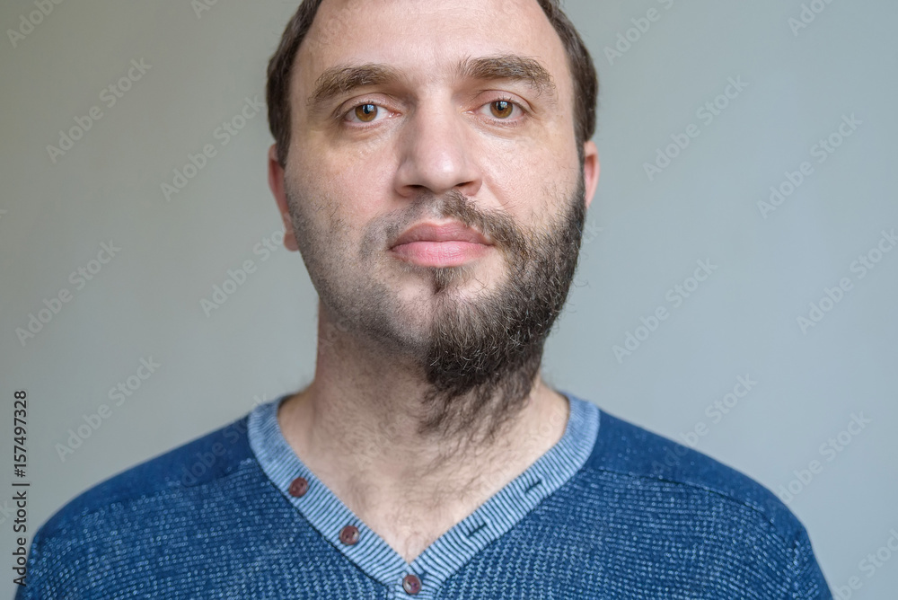 Fototapeta premium Portrait of handsome man with half shaved beard